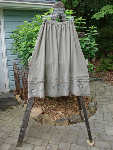 1995 Wish Skirt Ball & Bone Rain Cloud Size 2 displayed on a clothes rack, featuring a full elastic waistband, deep side pockets, and antique lace accents, showcasing its sweeping A-line shape.