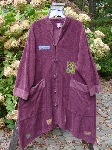 2000 Patched Bette Robe Coat Murple Size 2: A purple robe with vintage buttons and exterior pockets, made from heavy cotton chenille.