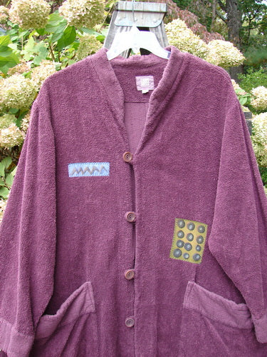2000 Patched Bette Robe Coat Murple Size 2: A thick cotton chenille robe with vintage buttons, angular pockets, and mixed theme patches.