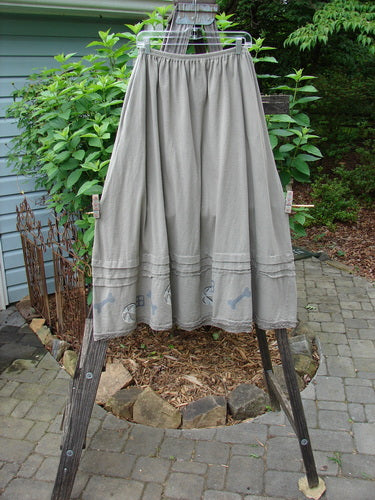 1995 Wish Skirt Ball & Bone Rain Cloud Size 2 on a clothes rack, featuring a sweeping A-line shape and vintage lace accents, perfect for adding a romantic touch to any outfit.