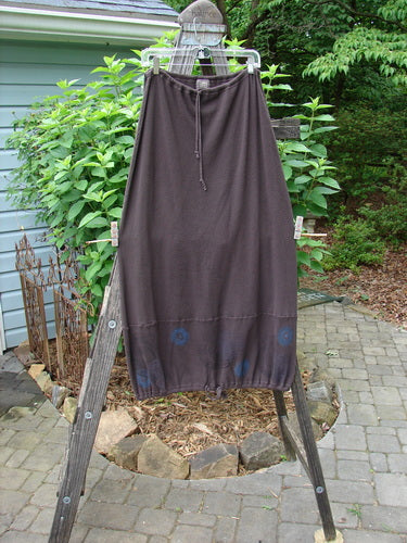 2000 Thermal Grattan Skirt Bubble Brum Size 1 displayed on a wooden rack, showcasing a paneled hemline with a full drawstring waist and painted bubble design, epitomizing vintage Blue Fish Clothing style.