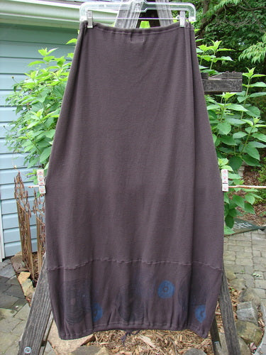 2000 Thermal Grattan Skirt Bubble Brum Size 1 hanging outdoors on a clothesline, showcasing its full drawstring waistline, sectional lower horizontal panel, and classic Winter 2000 bubble theme painted hemline.