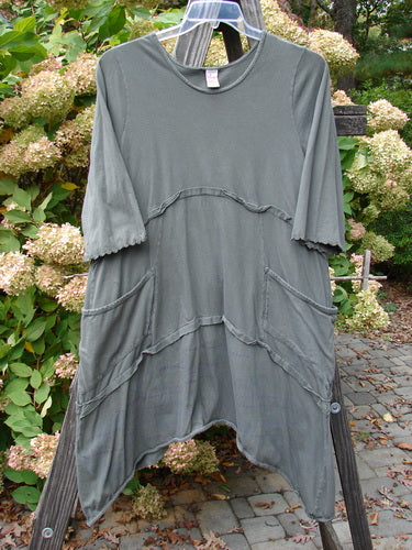 Barclay Cotton Lycra Raw Edge Vector Pocket Tunic, grey shirt with flutter accents, wrap side pockets, and turned-up rolled hem. Size 1.