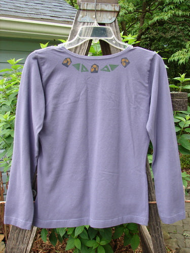 1996 Long Sleeved Cotton Lycra Layering Top Ram Mulberry Size 1: Purple shirt with a continuous ram design, long sleeves, rounded shallow neckline, tapering waist, and slight lower flair.