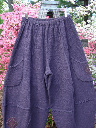 Barclay Patched Crepe Sectional Pocket 4 Square Pant Diamond Brum Size 1 displayed outdoors, featuring a unique 3D diamond cut, elastic waistband, and large patch pockets, showcasing Bluefishfinder.com's creative vintage style.