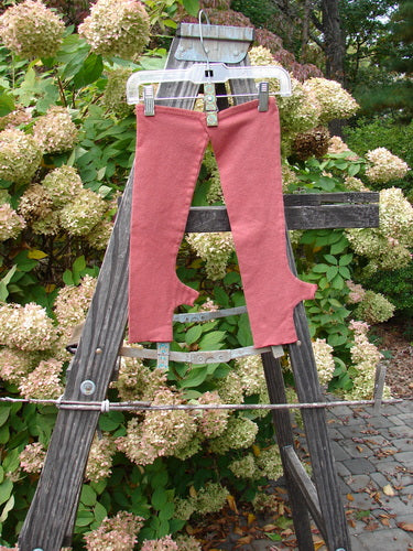 Image alt text: Barclay Cotton Lycra Hemp Fingerless Glove on wooden ladder, showcasing sweet lettuce edgings, four finger opening, thumbholes, and cozy fit.