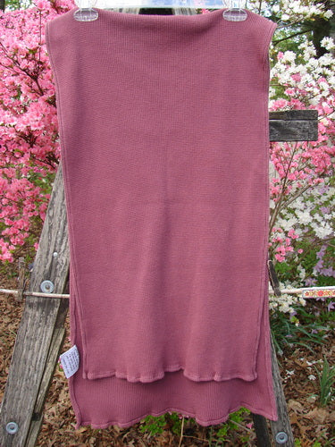 1992 Thermal Scarf Unpainted Mulberry OSFA shown hanging from a rustic wooden frame, displaying its rib-knit texture and sweet curly edges, highlighting the scarf's cozy and generous dimensions.