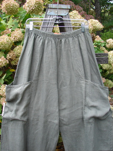 Barclay Linen Side Pocket Summer Pant on a swinger. Generous front side back wrap exterior pockets, sectional seams, and a slight crop length. Size 1.