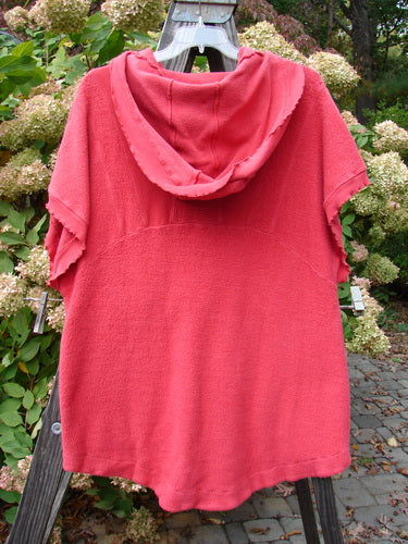 Barclay Celtic Moss Hooded Pocket Cardigan in Geranium, Size 0: Short-sleeved red cardigan with floppy hood, two exterior pockets, and curly edgings.