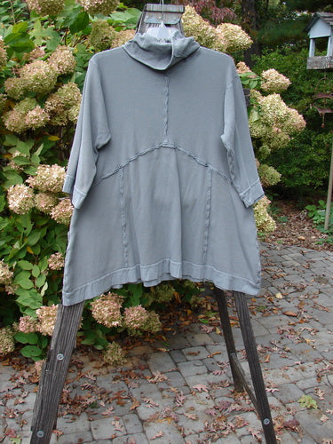 Barclay Thermal Reverse Stitch Pocket Dress, a grey shirt with a hood on a swinger, showcasing cozy exterior stitchery and oversized front pockets.