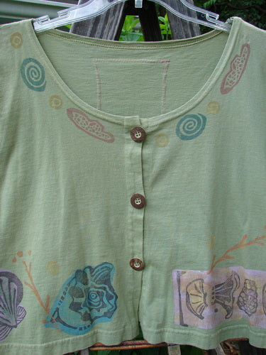Vintage 1993 Travel Top with Beach Treasure theme in Kelp, altered to size 2. Features a deeply scooped neckline, crop shape, and wooden accented buttons. From BlueFishFinder's collection of unique, expressive pieces by Jennifer Barclay.