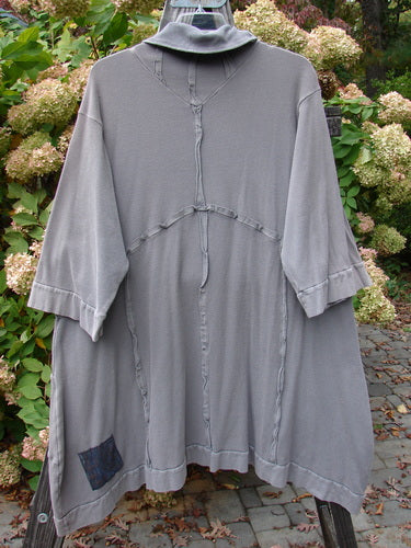 A grey long dress with a hood and pockets, made from medium weight cotton thermal. Size 2.