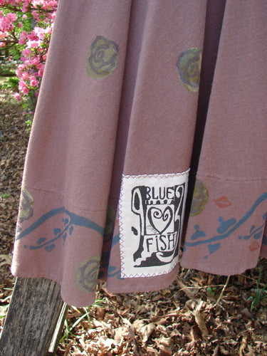 1993 Short Column Vest Floral Vine Rosewood OSFA displayed outdoors, showcasing circular floral motifs with a blue vine border. Features a Blue Fish patch and vintage design elements, embodying Bluefishfinder's unique vintage style.