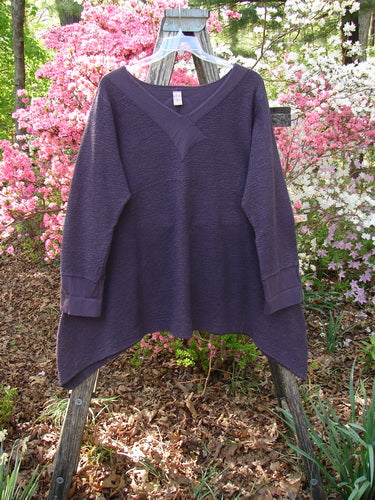 Barclay Patched Crepe Cross Over Tunic Top Diamond Brum Size 1 draped over a wooden ladder, showcasing its textured cotton crepe fabric, cross over neckline, handkerchief hem, and three-quarter sleeves.