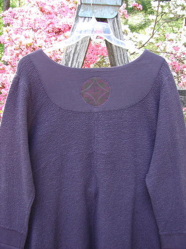 Barclay Patched Crepe Cross Over Tunic Top Diamond Brum Size 1 featuring a textured cotton crepe fabric, cross over neckline, three-quarter sleeves, dual pockets, and decorative yoke detail, hung outdoors.