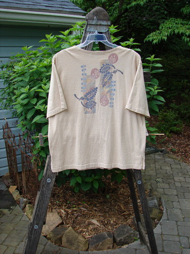 1994 Camp Shirt Berry Fern Garden Flaxen Altered Size 1 on a mannequin outdoors. Features include varying hemline, wider neckline, oversized breast pocket, original Blue Fish buttons, vented sides, drop shoulders, wider sleeves, and vintage Blue Fish patch.