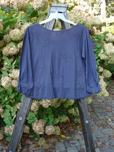 Barclay Batiste Gather Sleeve Crop Top with star adornment on a wooden stand. Size 2.