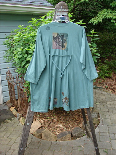 Vintage 1994 Falling Leaves Jacket with Asian forest and leaf theme in Deep Sea. Altered for one size fits all. Features original Blue Fish buttons, A-line shape, and cord accent. Length: 35. From BlueFishFinder.com.