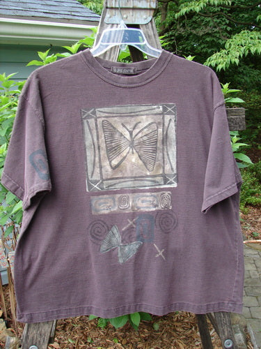 Vintage 1995 Short Sleeved Tee featuring a butterfly design from Madderlake. Altered for a slimmer fit, made of organic cotton. Details include ribbed neckline, drop shoulders, and atom paint. Bust 52, Waist 52, Hips 52, Length 26.
