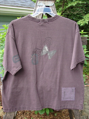 1995 Short Sleeved Tee Butterfly Madderlake Altered Size 2: Organic cotton tee with butterfly design, altered for slimmer fit. Features ribbed neckline, drop shoulders, atom paint details, and boxy shape. Vintage Blue Fish Clothing.
