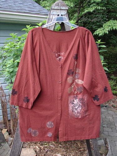Vintage 1994 Haiku Jacket featuring a Forest Vase design in Cinnabar hue. Altered for a unique silhouette with front pleats. Crafted from medium-weight cotton with a V neckline and recycled paper buttons.
