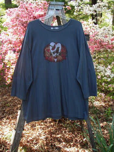 Barclay Long Sleeved Studio Tee Metallic Love Dove Steel Grey OSFA, features heart-shaped graphic with birds, floral elements, draped over a stepladder, showcasing its unique design and generous fit.