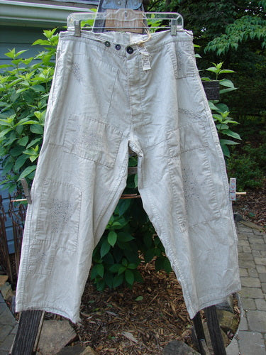 Magnolia Pearl NWT Patched Lilou Trouser Black Pinstripe OSFA hanging on a clothesline. Wider straight leg with overlay patches, front pockets, and accent stitchery. Vintage Blue Fish Clothing essence.