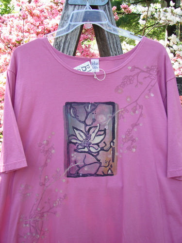 Barclay NWT Short Sleeved Studio Tee Single Cherry Blossom Alegra Size 3, featuring a stylized blossom panel, hangs on a wooden ladder, embodying Bluefishfinder's unique, creative vintage style.