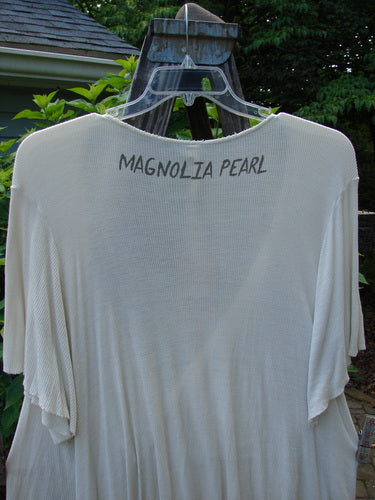 Magnolia Pearl NWT Ribbed Origami Wrap Blouse Moonlight OSFA featuring black text, deep neckline, two exterior ties, and flowing fabric, perfect for expressing individuality through vintage-inspired fashion.
