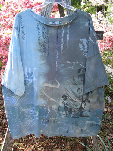 Barclay Center Seam Wide Line Tee Windy Bonsai Mottled Day Storm OSFA, featuring an Asian-inspired scene, loose cut, and seamless design, displayed on a hanger over a wooden ladder.