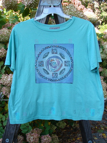 Barclay Short Sleeved Crop Box Rose Medallion Aqua Size 3: Oversized blue shirt with flower design and ribbed neckline.