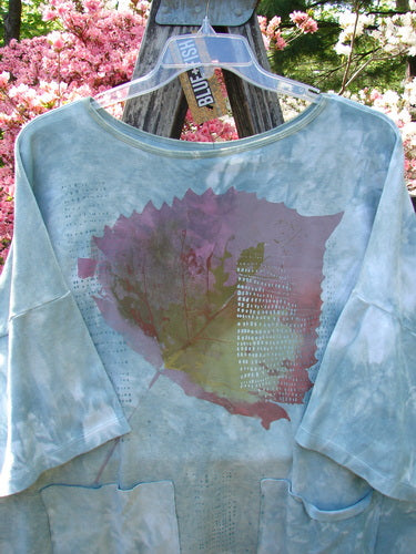 Barclay NWT Cotton Lycra Writer's Pocket Pullover Sweatshirt Leaf Mottled Asper OSFA displayed on a clear hanger, featuring a large leaf graphic, elbow-length sleeves, and dual front pockets.
