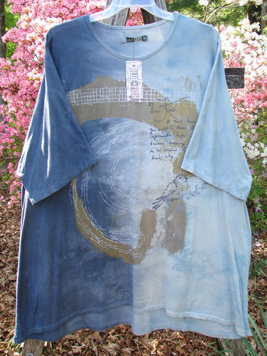 Barclay NWT Art Tee Center Script Bird Mottled Ink Sky Bronze OSFA features darker and lighter-blue panels with abstract prints, including a circle, grid, cursive script, and bird sketch, hanging outdoors.