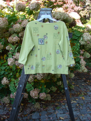 Image alt text: Barclay Three Quarter Sleeved Deep Neck Tee with Single Window Art on Citron background, size 1.