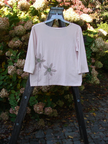 Barclay Cotton Lycra Three Quarter Sleeved A Line Tee Double Daisy Pink Tile Size 1 displayed on a swing, highlighting floral patterns and rounded neckline.