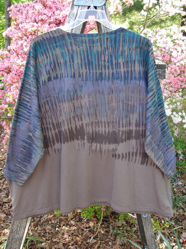 Barclay Cotton Lycra Writer's Pocket Pullover Sweatshirt Rear Rain Dark Bark OSFA, displayed outdoors on a trellis, features a kimono-style cut with dual drop flop pockets and seamless design.
