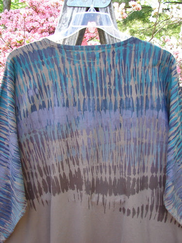 Barclay Cotton Lycra Writer's Pocket Pullover Sweatshirt in Dark Bark, featuring a tie-dye design with blue and gray bands, hanging outdoors, showcasing its unique seamless front and flair.