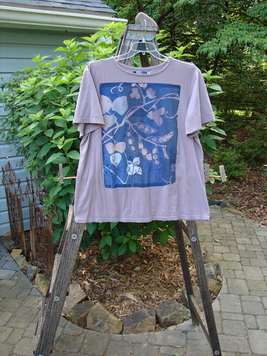 Barclay Short Sleeved Tee Leaf Branch Lilac Size 0, displayed on a hanger, featuring a detailed leaf branch design and wider short sleeves, made from organic cotton.