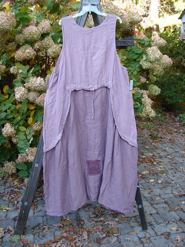 Barclay PMU Linen Explorer Jumper Pansy Lavender Size 2: A lavender dress with an overlay full bodice, billowy lower sweep, and pansy theme paint.