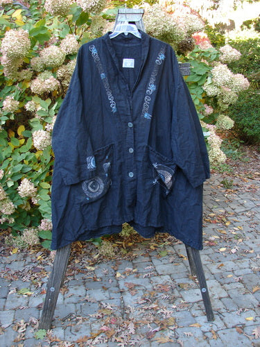 Barclay Hemp Cotton Carriage Coat Celestial Black OSFA: A heavy-weight linen-like coat with a V-shaped neckline, oversized pockets, and a sweeping A-line shape.