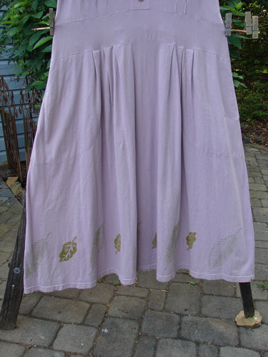 2000 Lulu's Dress Leaf Hyacinth Size 1 displayed on a rack, showcasing its drop waistline, pleated front darts, wide swingy lower, and inseam pockets, highlighting its vintage charm.