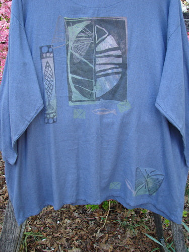 1995 Silk Noile Long Sleeved Top Leaf Fish Butterfly Dusk OSFA, draped on a bench, features abstract art in greens and purples with fish and butterfly motifs, showcasing Bluefishfinder's vintage style.