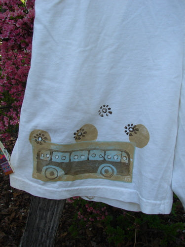 2000 Bushel Short Bus Travel Milk Size 1: A white cotton T-shirt with hand-painted bus design and floral motifs, new with tag.