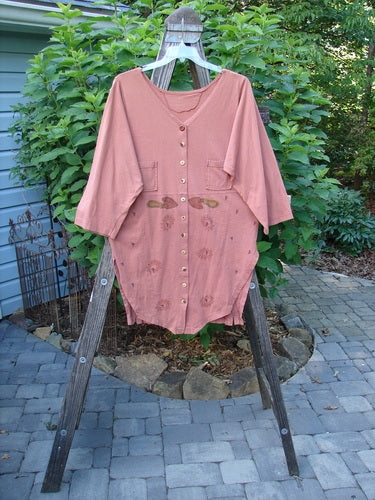 1994 Grasshopper Coat Garden Tools Gourd Size 1 on wooden rack, showcasing a deep V neckline, original buttons, upper pockets, and buttoned vents, reflecting vintage Blue Fish Clothing's unique style.