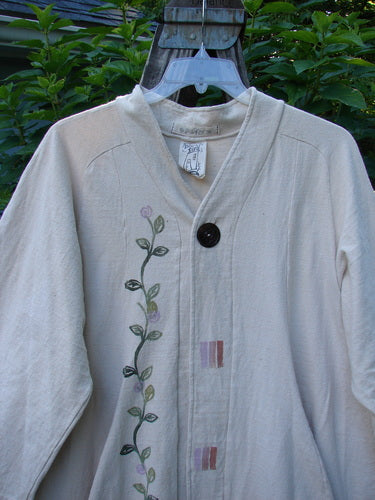 1996 Reprocessed Spring Rain Jacket Garden Vine Birch Bark OSFA, featuring a detailed garden vine design, vintage closure, widening A-line shape, and deep side pockets, made from thick, dense reprocessed cotton.