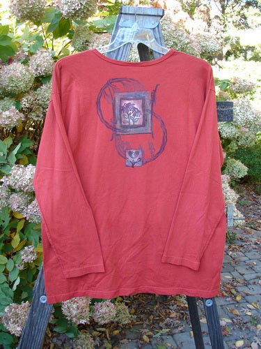 Barclay Long Sleeved Tee Geisha Gal Geisha's Robe Size 1: A red long sleeved shirt with a close-up of a painting and a close-up of a wood post.