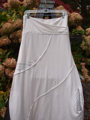 A cream stripe cotton lycra lantern skirt with a fold-over waist, bell shape, and sweet gray stripe accents. Size 2.