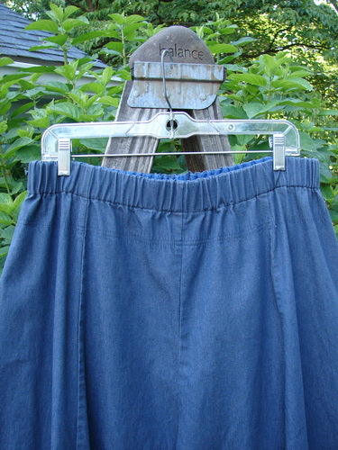 A pair of Barclay Light Weight Denim Crop 4 Square Pants Unpainted Indigo Size 2 displayed on a swinger, featuring a billowy bottom and unique 3D diamond cut from the knee down.