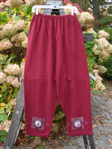 1997 Holiday Simple Pant Balanced Atom Regalia Size 0: A pair of pants with an atom theme design, made from organic cotton. Features include a full elastic waistband, deep side pockets, and a slightly straighter fall.