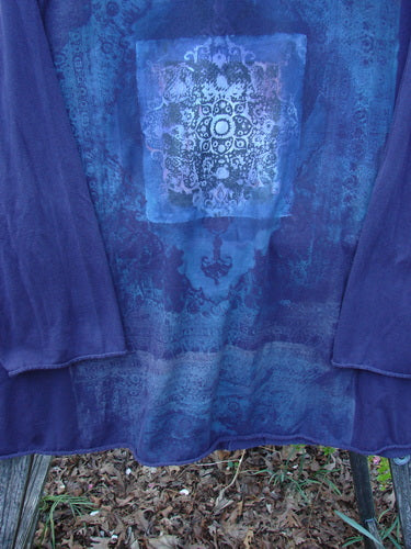 Barclay Long Sleeved A Line Tee Celtic Journey Purple Royal Size 1, featuring an ornate mandala print on the front, displayed outdoors, emphasizing its organic cotton fabric and unique swirling patterns.